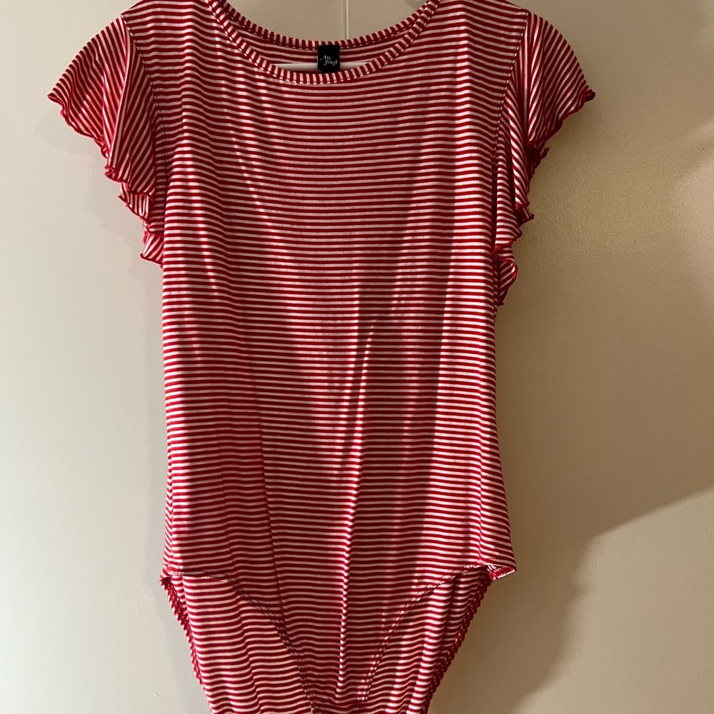 Red and white striped body suit .